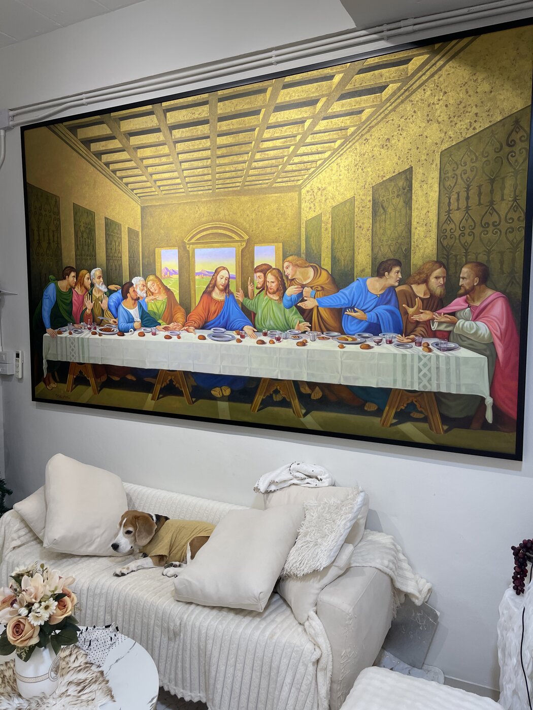 Large Last Supper painting in a living room